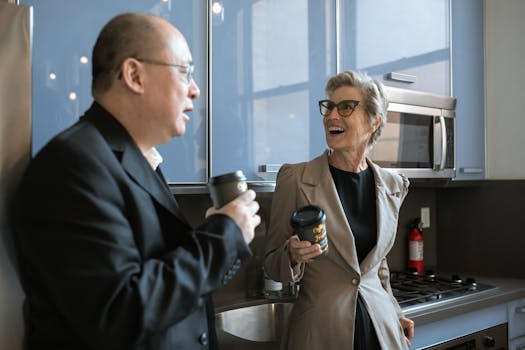 Man in Black Suit Holding Black Ceramic Mug