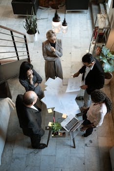 People Sitting on Chair in Front of Table